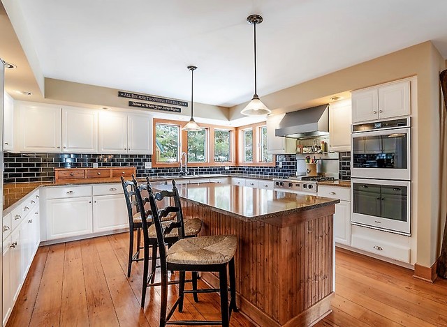 8N261 Thomas Road Maple Park, IL 60151 - Photo 10 of 36 a large kitchen with a table chairs and flat screen tv