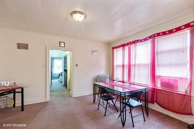 Undisclosed Address Chicago, IL 60619 - Photo 5 of 12 a dining room with furniture and window