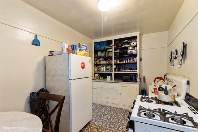 Undisclosed Address Chicago, IL 60619 - Photo 6 of 12 a white refrigerator freezer sitting inside of a kitchen