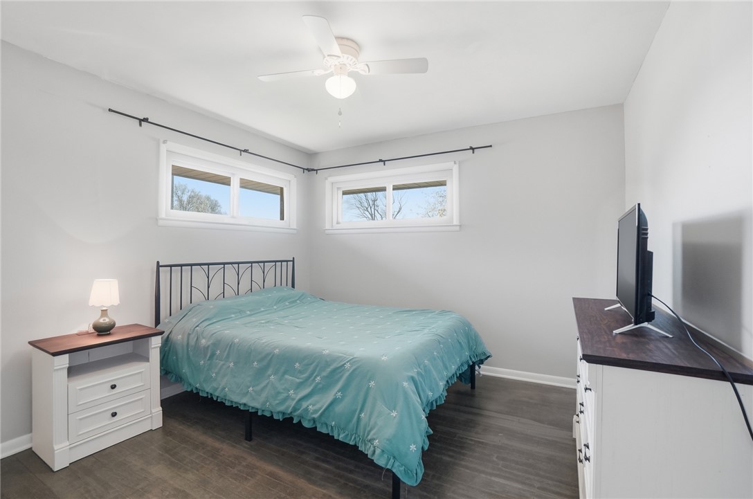 1325 Chelsea Road Troy, OH 45373 - Photo 19 of 42 This cozy bedroom features durable flooring and a ceiling fan, creating a comfortable living space.
