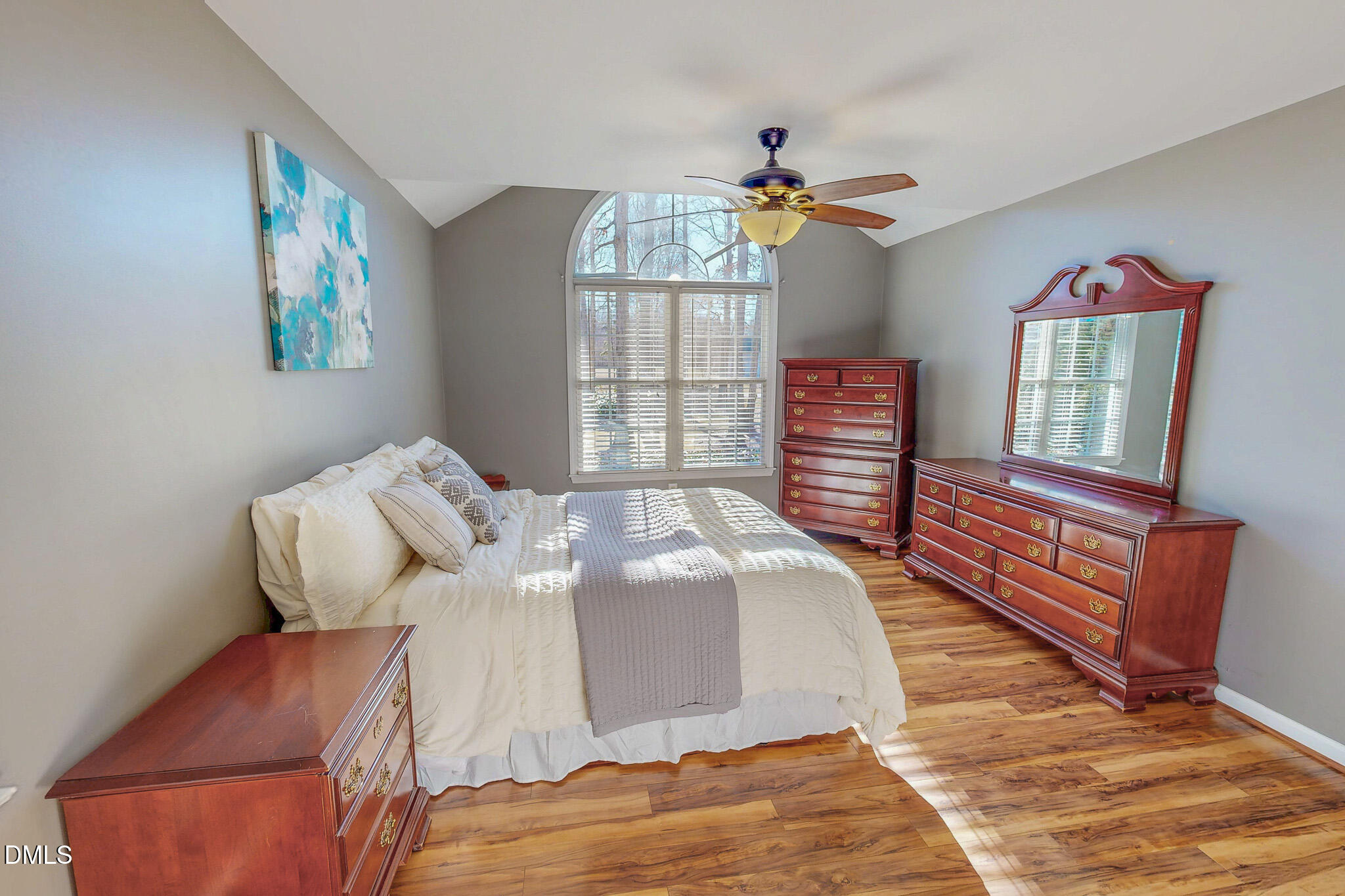 60 Forest Drive Timberlake, NC 27583 - Photo 13 of 40 a bedroom with a bed and wooden floor