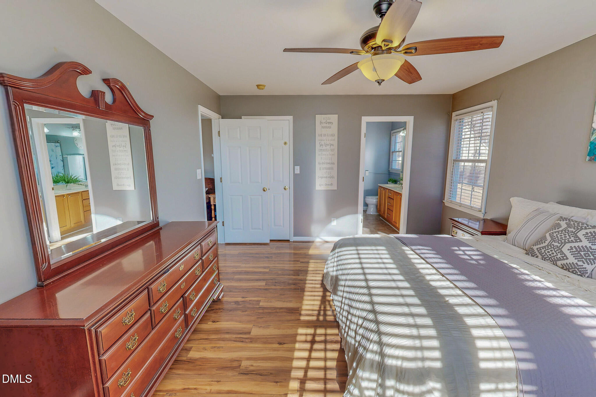 60 Forest Drive Timberlake, NC 27583 - Photo 14 of 40 a bedroom with a bed and a chandelier