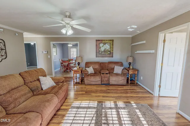 a living room with furniture and a rug