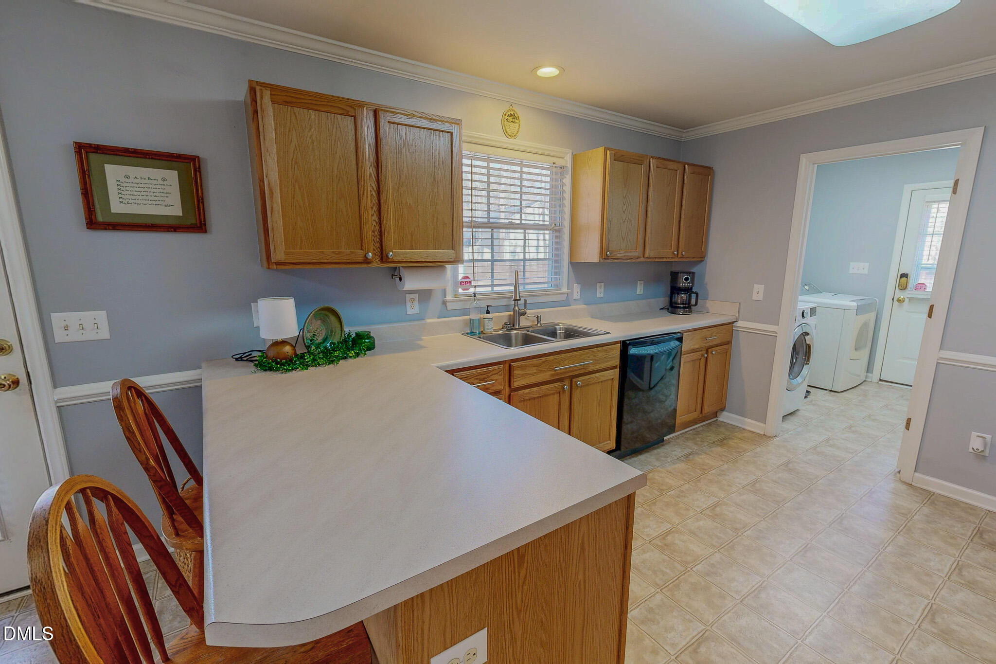 60 Forest Drive Timberlake, NC 27583 - Photo 22 of 40 a kitchen with a sink a stove and cabinets