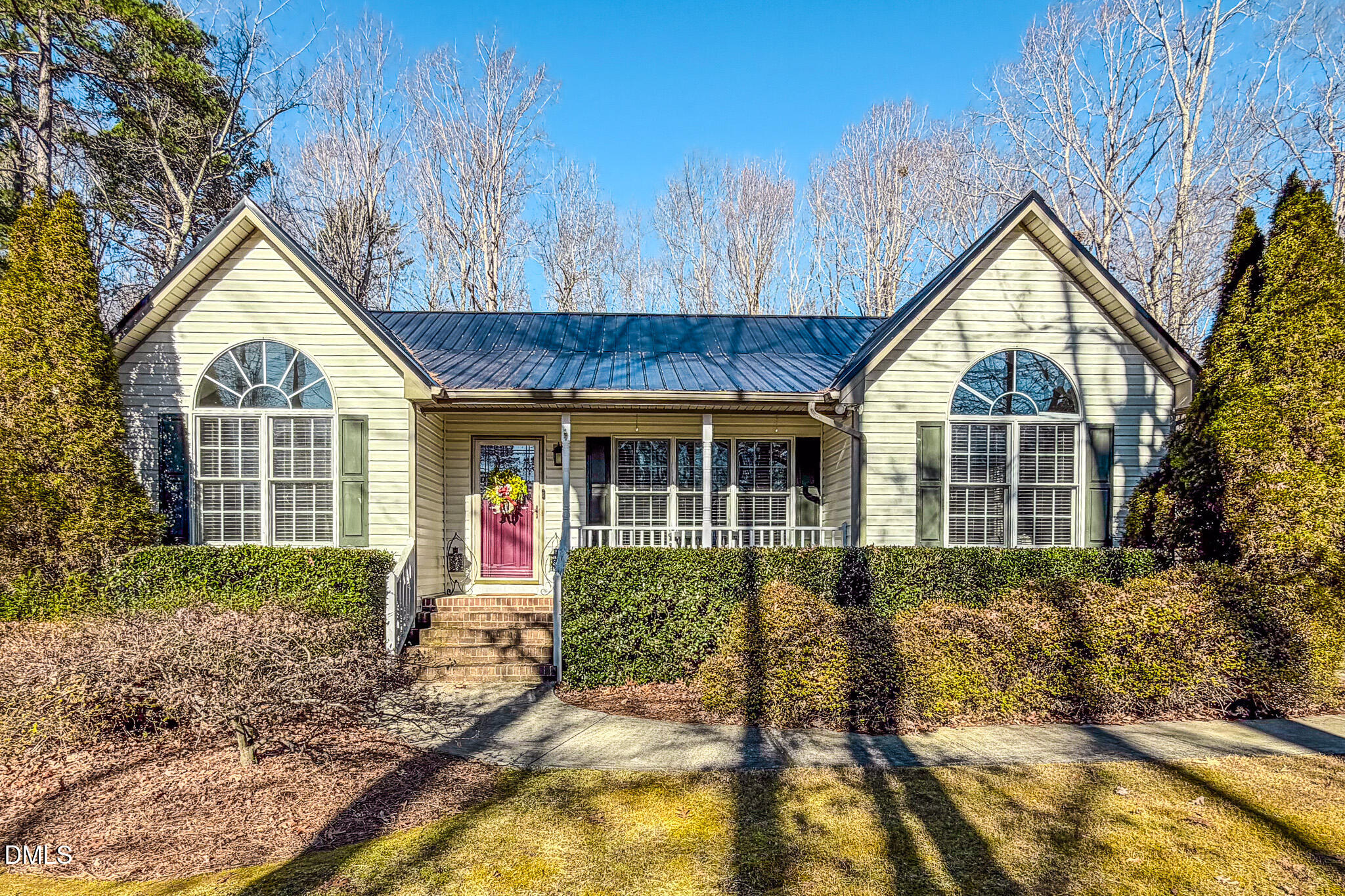 60 Forest Drive Timberlake, NC 27583 - Photo 31 of 40 a front view of a house with garden