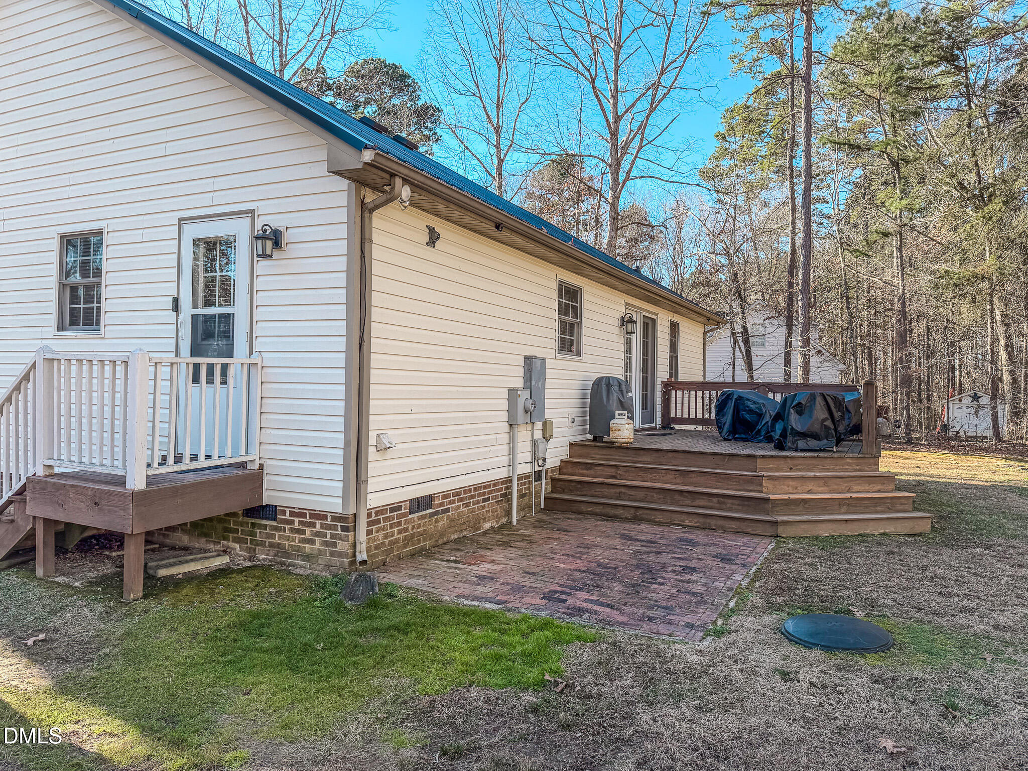 60 Forest Drive Timberlake, NC 27583 - Photo 32 of 40 a view of a house with backyard and a chair