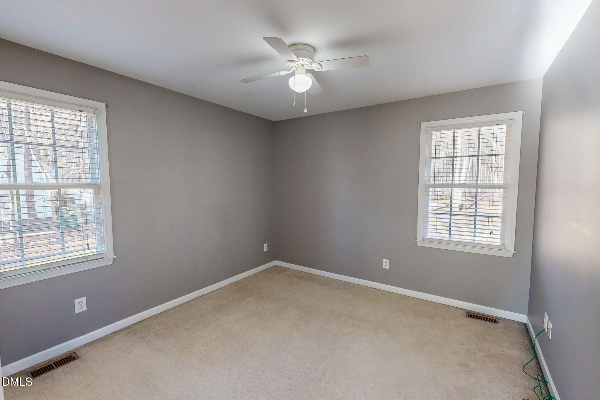 60 Forest Drive Timberlake, NC 27583 - Photo 39 of 40 an empty room with windows and ceiling fan