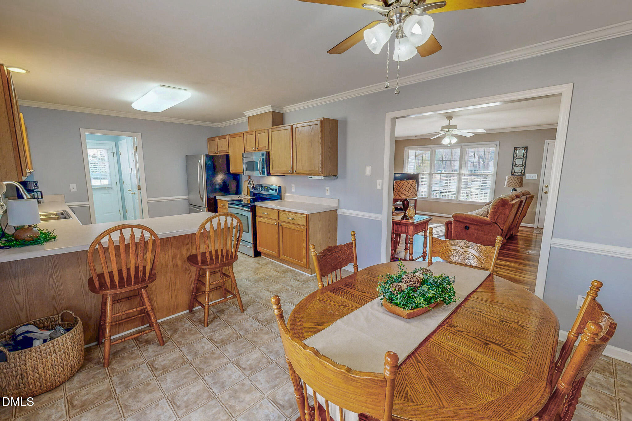 60 Forest Drive Timberlake, NC 27583 - Photo 4 of 40 a living room with furniture and a chandelier