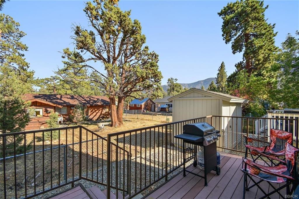 613 Riverside Avenue Sugarloaf, CA 92386 - Photo 2 of 27 a view of a chairs on the roof deck