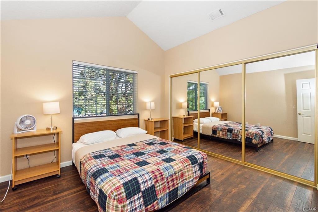 613 Riverside Avenue Sugarloaf, CA 92386 - Photo 15 of 27 a bedroom with a bed and a window
