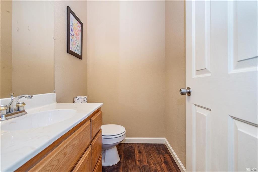 613 Riverside Avenue Sugarloaf, CA 92386 - Photo 20 of 27 a bathroom with a sink and a toilet