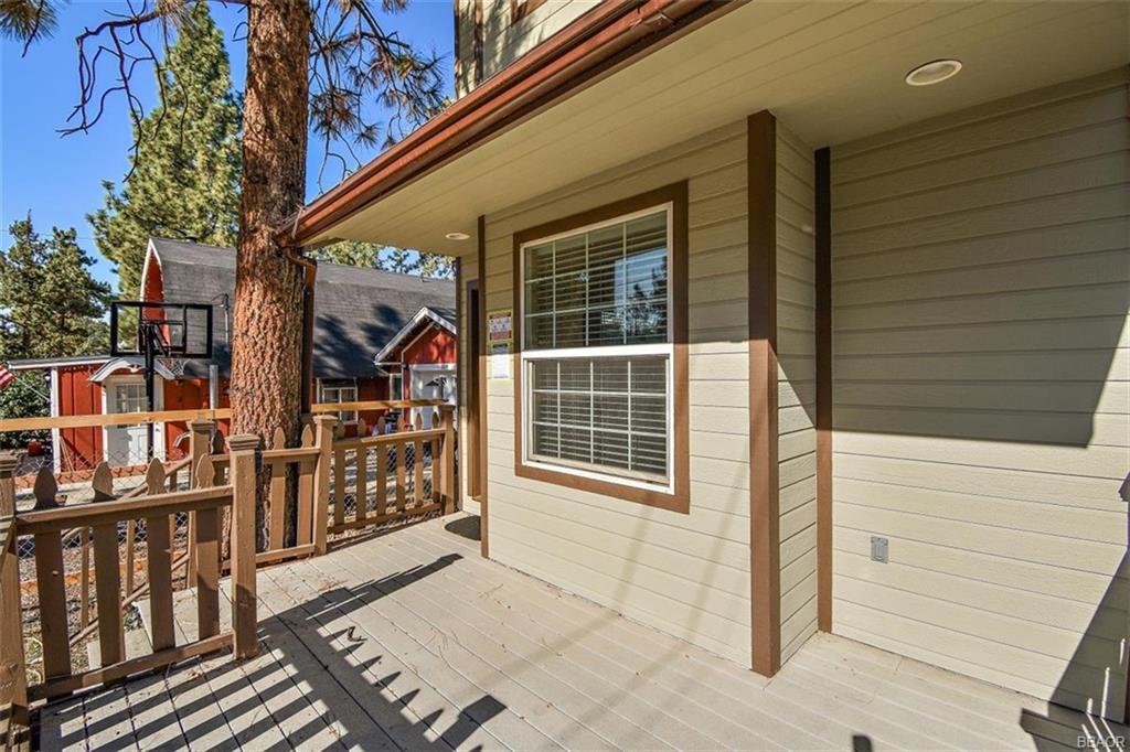 613 Riverside Avenue Sugarloaf, CA 92386 - Photo 25 of 27 a view of a house with a door