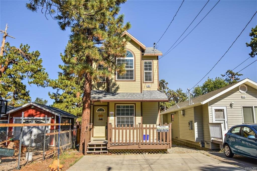 613 Riverside Avenue Sugarloaf, CA 92386 - Photo 26 of 27 a front view of a house with a garden