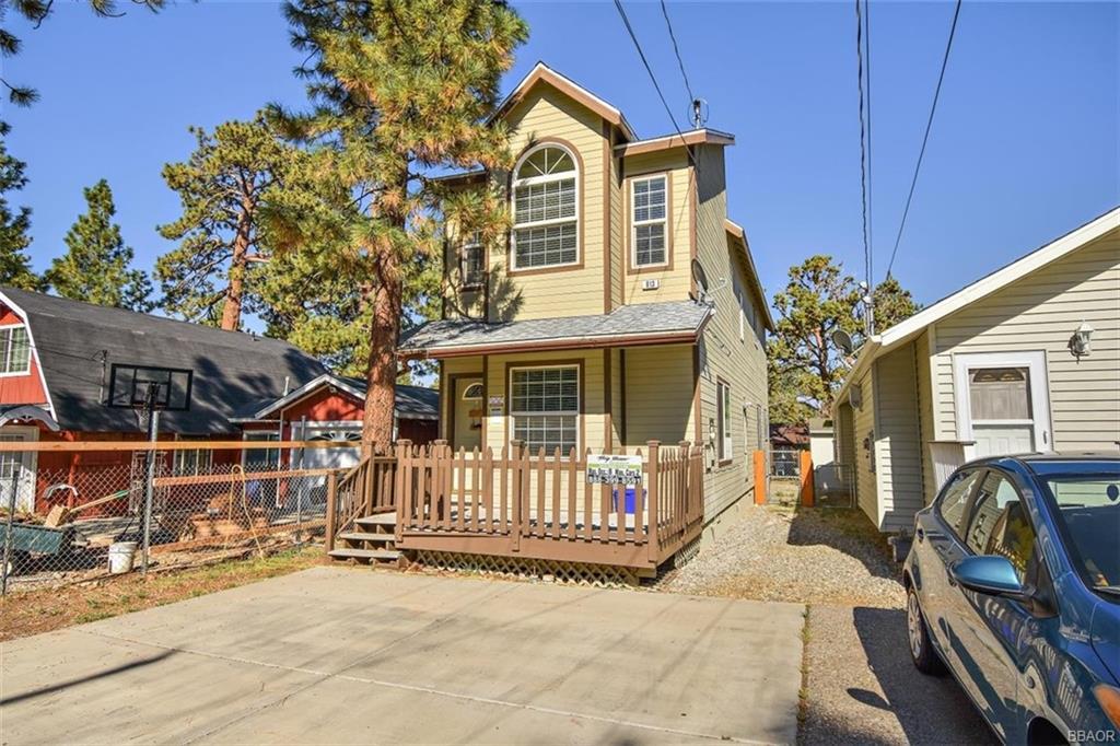 613 Riverside Avenue Sugarloaf, CA 92386 - Photo 27 of 27 a view of a house with wooden walls