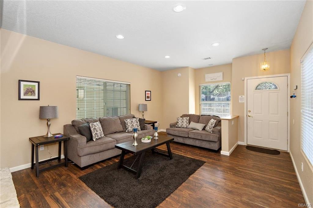 613 Riverside Avenue Sugarloaf, CA 92386 - Photo 5 of 27 a living room with furniture and a large window