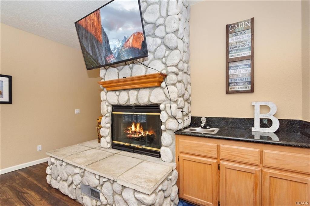 613 Riverside Avenue Sugarloaf, CA 92386 - Photo 6 of 27 a stove top oven sitting inside of a kitchen