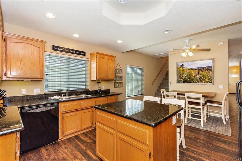 613 Riverside Avenue Sugarloaf, CA 92386 - Photo 8 of 27 a kitchen with granite countertop a sink and cabinets