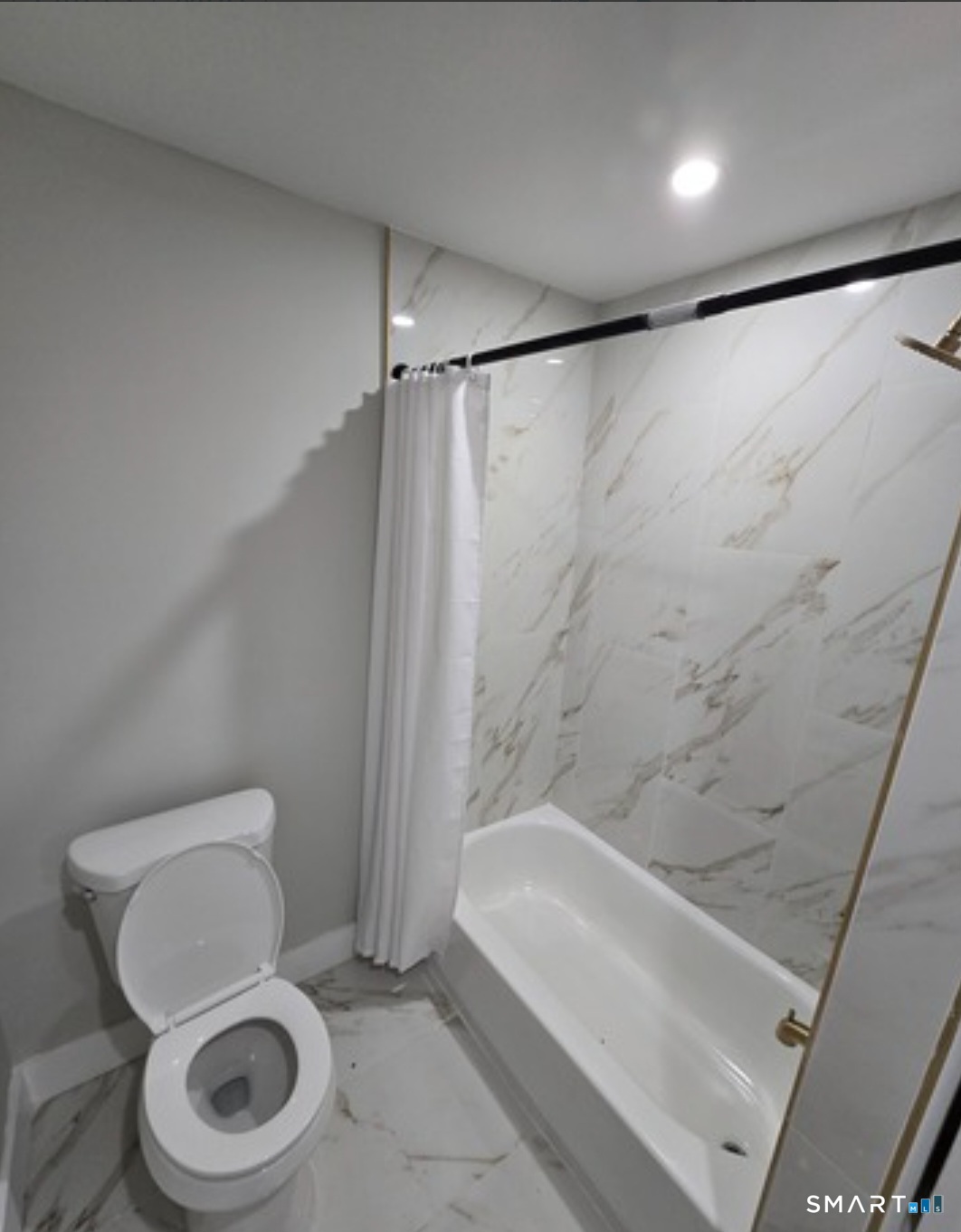 80 Dickerman Street New Haven, CT 06511 - Photo 11 of 12 a white toilet sitting next to a bath tub and a shower