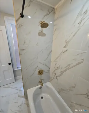a bathroom with a sink and a shower