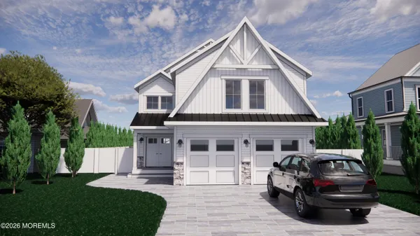 a front view of a house with a garden and plants