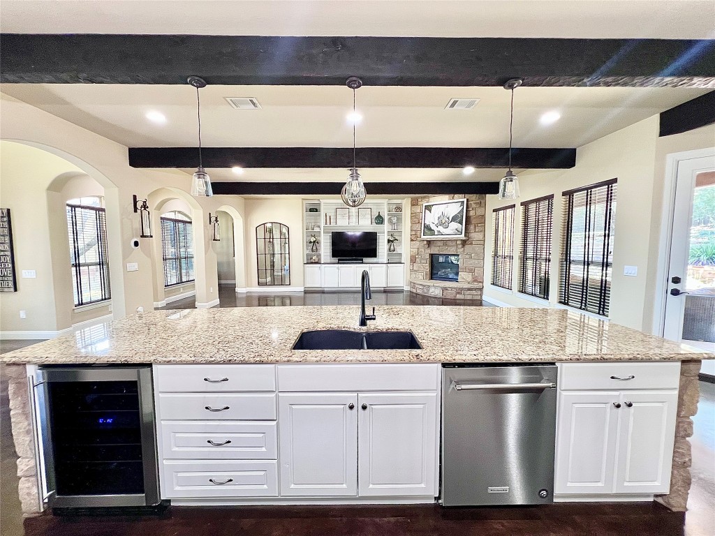 320 Ridge View Drive Georgetown, TX 78628 - Photo 29 of 31 a kitchen with stainless steel appliances granite countertop a sink and a granite counter tops