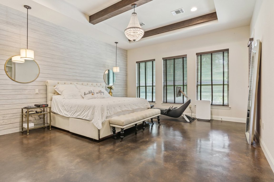 320 Ridge View Drive Georgetown, TX 78628 - Photo 10 of 31 a bedroom with a bed and wooden floor