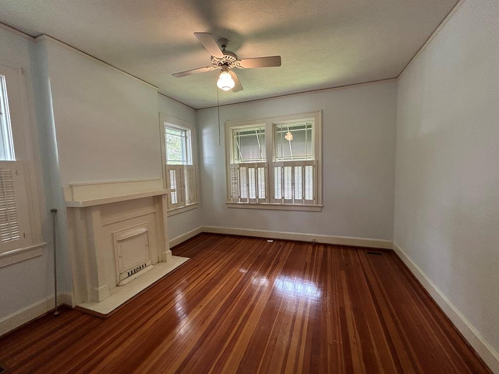 1192 Munro Avenue Columbus, GA 31906 - Photo 11 of 15 wooden floor in an empty room with a window