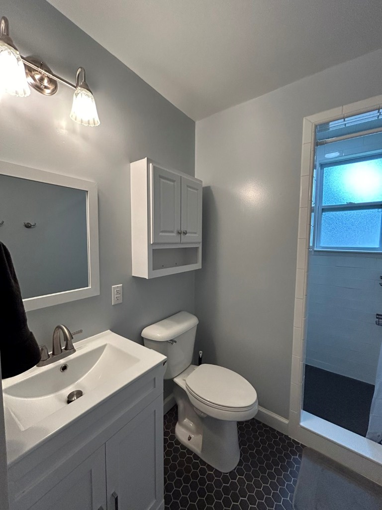 1192 Munro Avenue Columbus, GA 31906 - Photo 10 of 15 a bathroom with a toilet sink and mirror
