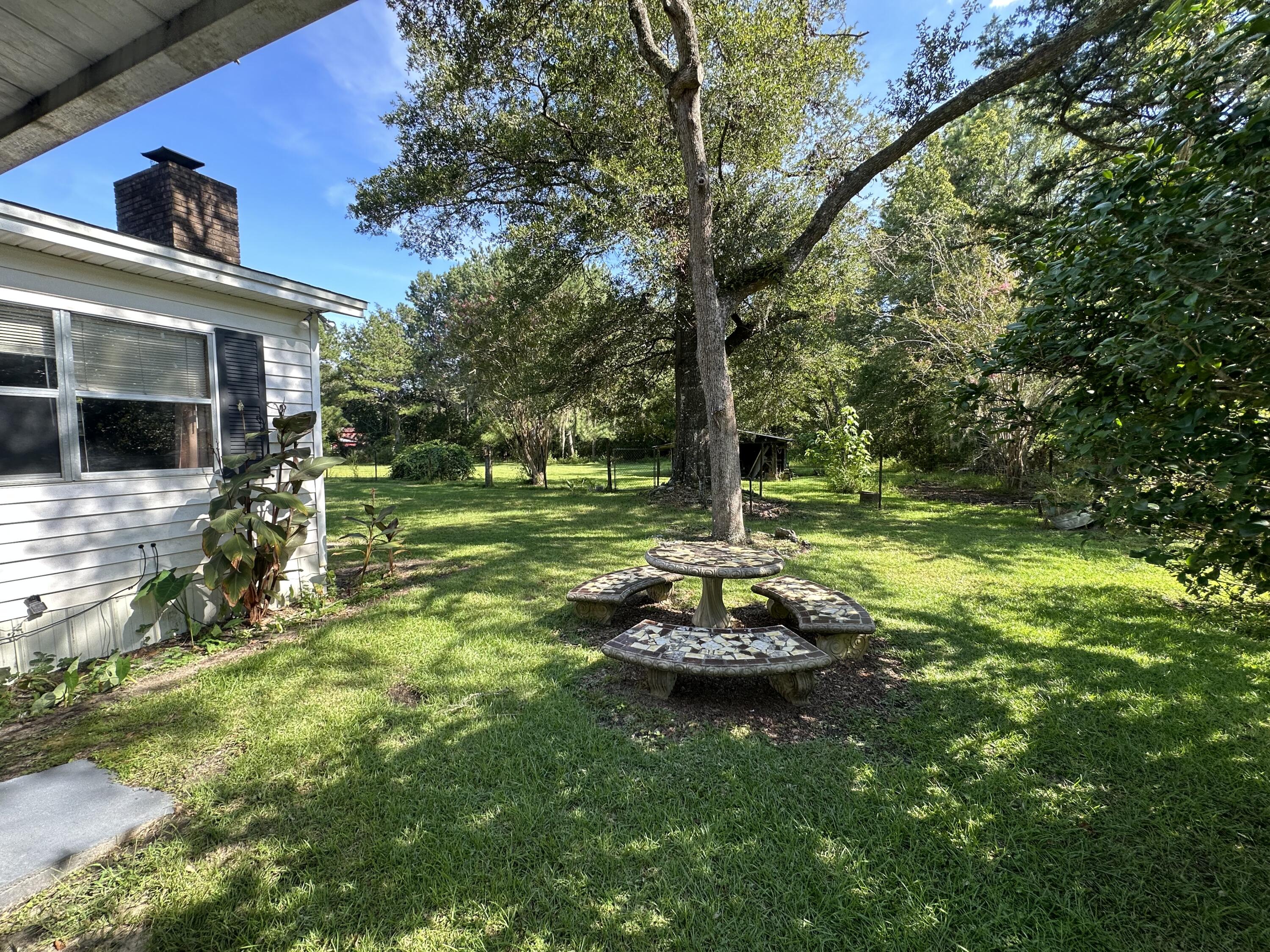 1875 Hathaway Johnson Road Baker, FL 32531 - Photo 20 of 40 a front view of a house with a yard