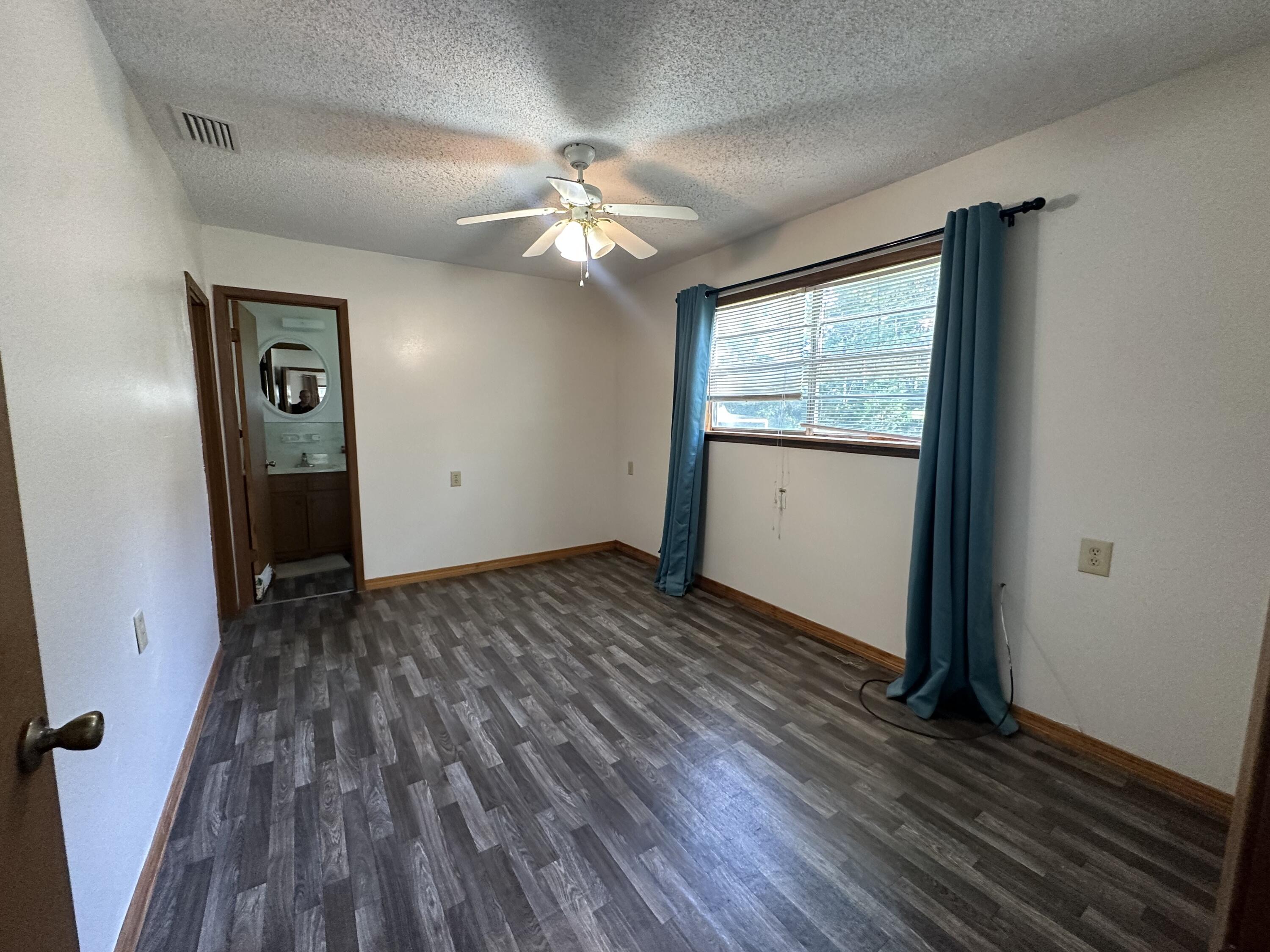 1875 Hathaway Johnson Road Baker, FL 32531 - Photo 7 of 40 wooden floor in an empty room with a window