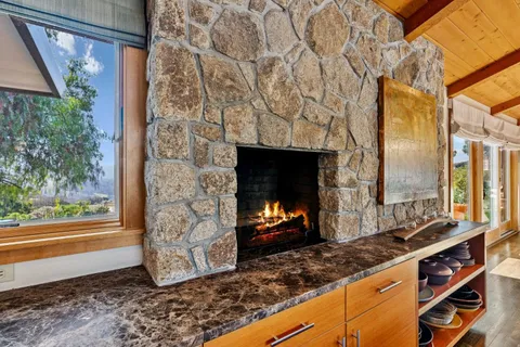 a kitchen with stove and cabinets