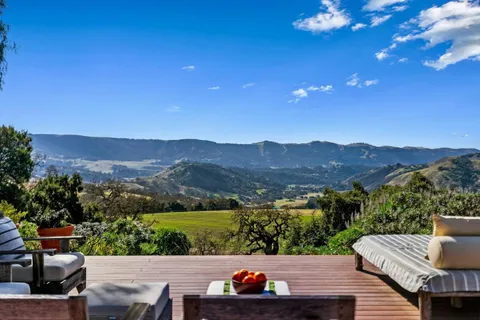 a view of city from terrace with seating space