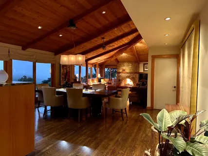 a living room with furniture fireplace and a window