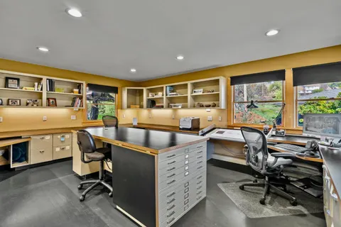 a view of a garden with sitting area