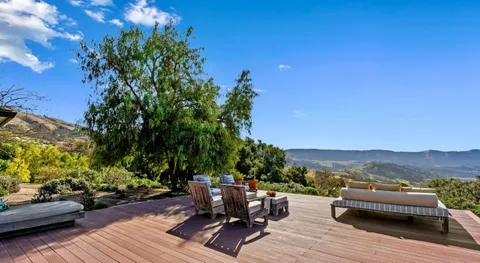 a outdoor space with patio furniture and potted plants