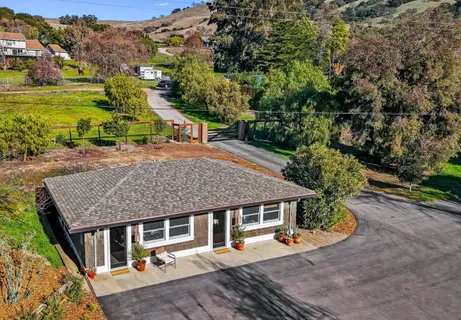 a room with furniture and pool table