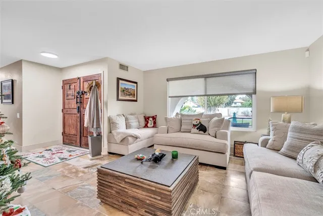 a large kitchen with stainless steel appliances lots of counter space and a refrigerator