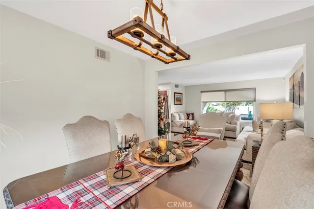 a kitchen with stainless steel appliances granite countertop white cabinets a sink and dishwasher