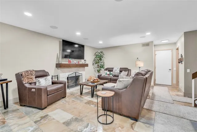 a bedroom with a bed a window and painting on the wall