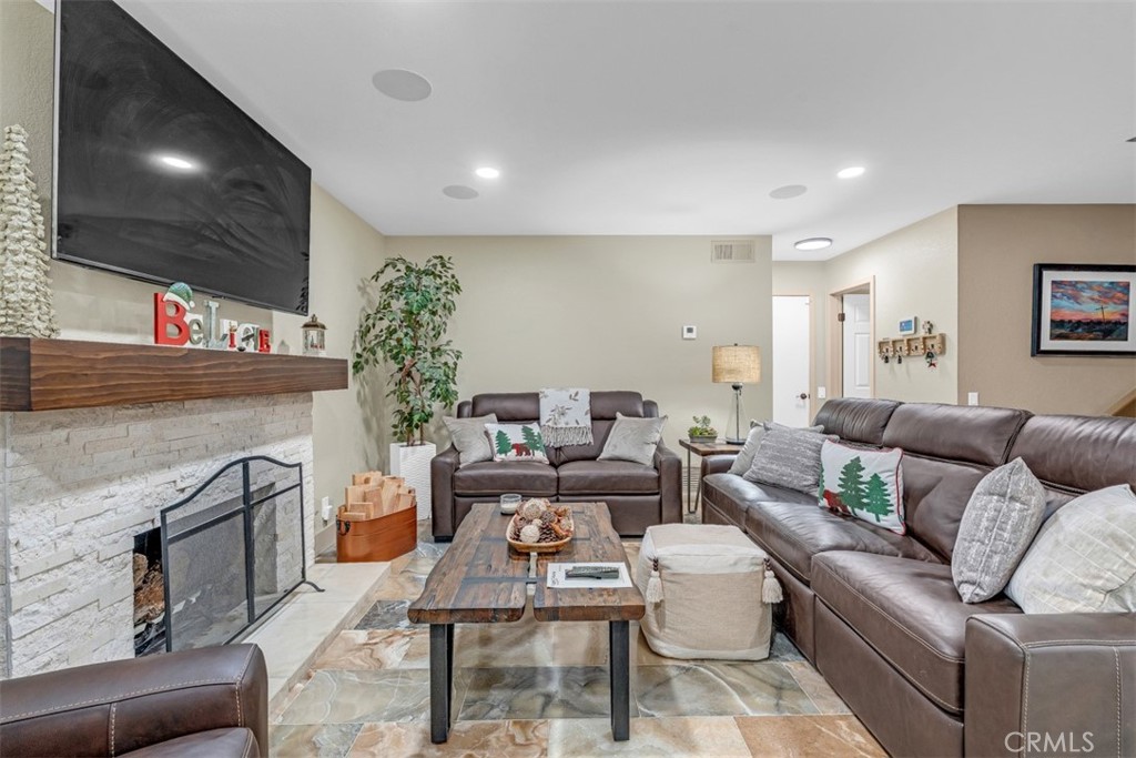 5056 Windhill Drive Riverside, CA 92507 - Photo 40 of 66 a living room with furniture and a flat screen tv