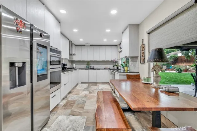 a spacious bedroom with a bed and a large window