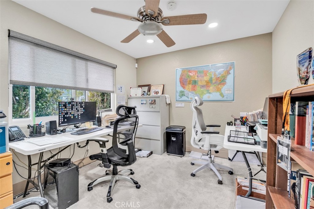 5056 Windhill Drive Riverside, CA 92507 - Photo 50 of 66 a view of a workspace with furniture and a flat screen tv