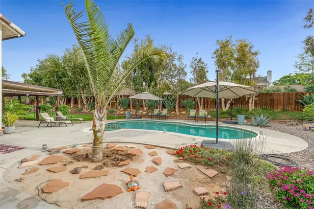 a view of a swimming pool with a patio