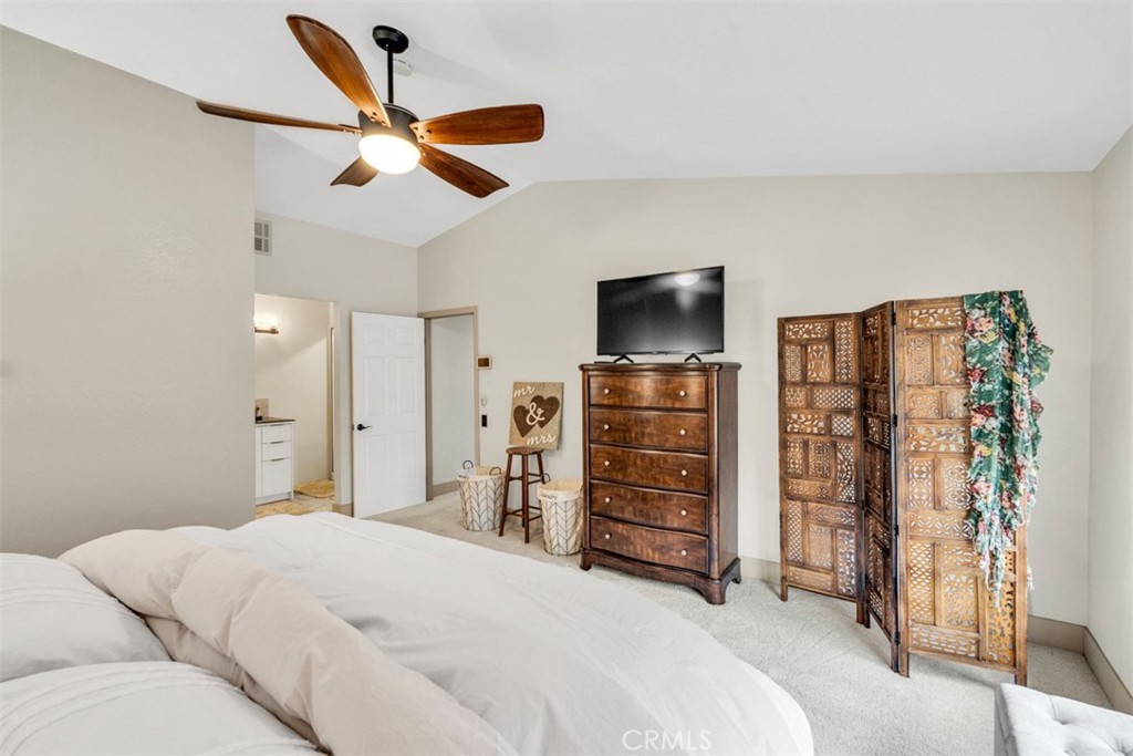 5056 Windhill Drive Riverside, CA 92507 - Photo 60 of 66 a bedroom with a bed and a flat screen tv