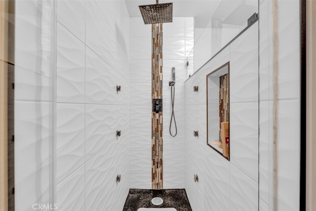 5056 Windhill Drive Riverside, CA 92507 - Photo 62 of 66 a bathroom with a shower and a sink