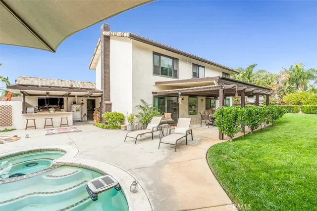 a view of a patio with table and chairs and potted plants