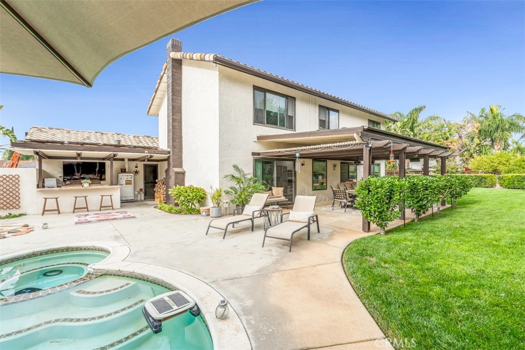 5056 Windhill Drive Riverside, CA 92507 - Photo 9 of 66 a view of a house with backyard porch and patio