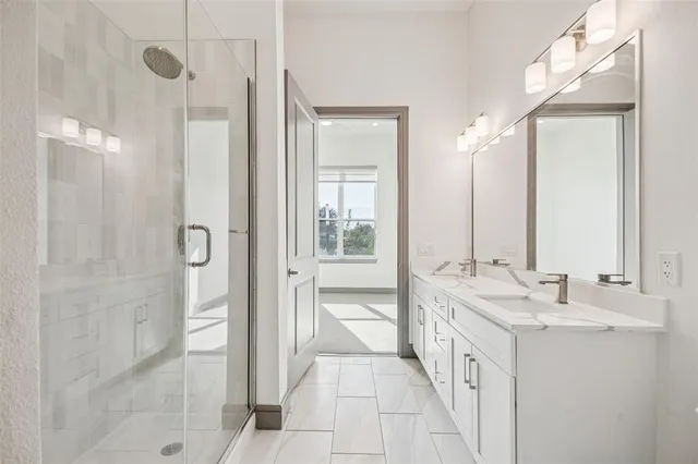 a bathroom with a tub sink and shower