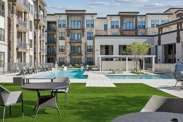 a view of a patio with couches table and chairs potted plants