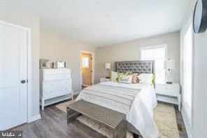 a bedroom with a bed and cabinets